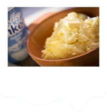 Bowl of mashed potato with butter and natural yogurt.