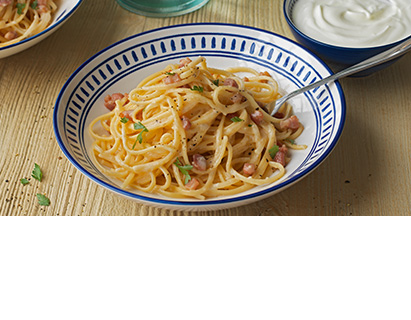 Think just outside the box. Dollop Greek style yogurt to your carbonara.